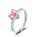 Macro view of heart-shaped pink zircon ring with shimmering micro-pave silver band - Adjustable Open / Pink Zirconia