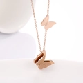 Detail of rose gold double butterfly necklace with polished and frosted metal finishes - Necklace Rose Gold