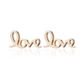 Macro detail of gold-plated Love letter earrings with high-polish finish and smooth curves - Gold