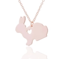Close-up of rose gold rabbit necklace with heart-shaped cutout on fine chain link - Rose Gold