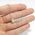 Macro view of silver Scorpio zodiac pendant with gothic font on a fine chain - Scorpio Steel