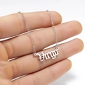 Detail showing the Virgo cursive font pendant on a delicate silver chain link necklace - Virgo Steel