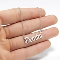 Detailed shot of Gemini zodiac pendant necklace in silver gothic font on fine chain - Gemini Steel