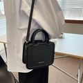 Minimalist black square tote bag with curved handle and thin golden shoulder strap - Black