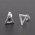 Close-up of minimalist hollow triangle stud earrings with a matte silver finish - Triangle Style / Steel