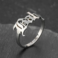 Gothic silver baby letter adjustable open ring in stainless steel on dark rock background - Devil Style (053) / Steel
