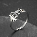 Silver stainless steel open ring featuring a retro 1998 cutout design on dark rock background - 1998 Style (054) / Steel