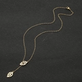 Elegante collar de cadena larga con doble colgante de hoja dorada y diseño de borla - Dorado