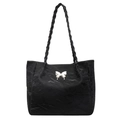 Détail du sac cabas noir avec papillon argenté et poignées au design tressé unique - Noir