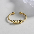 Minimalist gold twist open ring with polished metal beads on textured grey backdrop - Adjustable Open / Gold