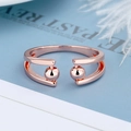 Adjustable rose gold stress relief ring with rotating beads on elegant blue background - Adjustable Open / Rose Gold