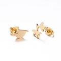 Macro shot of gold-plated bird and branch asymmetric stud earrings for women - Bird & Branch (139) / Gold