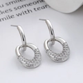 Eleganti orecchini a cerchio ovali in argento con pietre di zircone bianco lucido - Argento