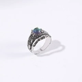 Macro detail of vintage adjustable ring with irregular texture and iridescent stone - Green Yellow Starry Sky