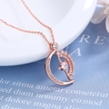 Rotating sun and moon pendant necklace in rose gold finish with star detail - Rose Gold Color (Rotating)