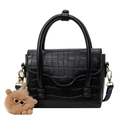 Elegant black crocodile pattern handbag with unique double cylindrical handles and plush charm - Black
