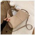 Detail of a beige PU leather tote bag featuring vertical stitching and adjustable strap - Khaki