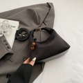 Elegant black crescent handbag with jacquard embroidery, leather trim and beaded charm - Black