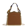 Brown leather handbag with gold metal trim, floral scarf handle, and chain strap - Brown