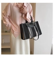 Detail of canvas tote bag with black and white stripes, leather handles and metal hardware - Small / Black