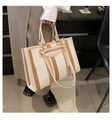 Detail shot of canvas tote bag with contrast vertical stripes and leather handles - Large / Khaki