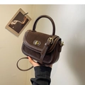 Vintage brown leather crossbody bag with gold buckle and textured contrast finish - Brown
