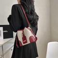 Chic beige canvas bucket bag with red leather trim and drawstring for women - Red