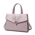 Pale purple crocodile embossed handbag with snake pattern flap and silver metallic details - Pink Bag