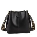 Black leather bucket bag with wide patterned shoulder strap and gold-tone hardware - Black