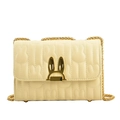 Cream quilted shoulder bag featuring a rabbit ear clasp and golden chain strap - Yellow