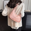 Pink minimalist half-moon hobo bag with wide adjustable shoulder strap and silver hardware - Pink