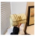 Beige quilted chain bag with gold rabbit ear clasp for women in elegant minimalist style - Yellow