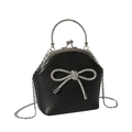 Elegante schwarze Handtasche mit Kristallschleife, Metallgriff und feinem Kettenriemen - Schwarz