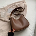 Brown leather hobo bag with wide shoulder strap and gold hardware in minimalist style - Coffee