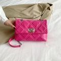 Chic magenta quilted crossbody bag with silver twist lock and chain strap on a blazer - Rose Red