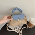 Straw woven crossbody bag in light blue leather trim with ruffle handle and floral charm - Blue