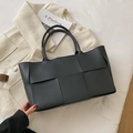 Large matte black woven leather tote bag with wide weave design and top handles - Black