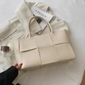 Minimalist beige woven tote bag in PU leather with double handles for daily commute - Off White
