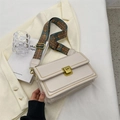 Cream rectangular crossbody bag featuring a retro geometric strap and gold buckle - White