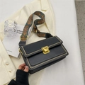 Retro black leather crossbody bag with ethnic print strap and gold metal clasp - Black