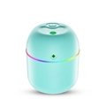 Vue macro de l'humidificateur USB vert menthe avec anneau LED dégradé sur fond blanc - X5 Vert