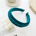 Detailed view of teal satin braided headband with texture in an elegant setting - Braided Braid Wide Edge Headband / Green