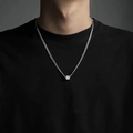 Men's minimalist silver titanium steel necklace with a geometric cube pendant on a model - Minimalist Cube Necklace X0100