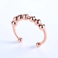 Anillo ajustable de oro rosa contra la ansiedad con ocho cuentas giratorias y pulido - Abierto Ajustable / Oro rosa