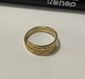 Macro detail of gold-plated stainless steel ring with nevertheless she persisted engraving - Persisted Style (082) / Gold