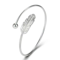 Detail shot of silver feather bangle with polished bead tip on white background - White Gold