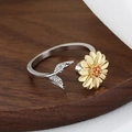 Adjustable silver sunflower ring with gold petals and orange crystals on wooden stand - Sunflower-Spinner 09