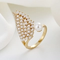 Golden wing open ring with large white pearl and marquise stones on a luxury fabric background - Adjustable Open / Gold