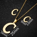 Detail of gold letter C pendant and earrings set with dimensions on black background - C Gold