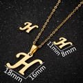 Macro shot showing size dimensions for gold cursive letter H necklace and earrings set - Gold H